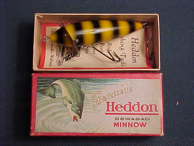 Sold at Auction: Heddon jointed vamp, w red head, gold flitter finish, 2  pc. flap rig. GE, signed on the belly, some varnish flaking. (VG-)